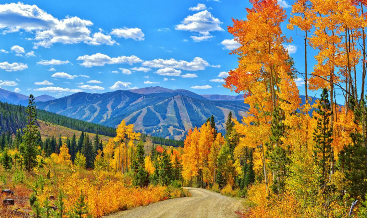 colorado mountains in the fall with a ski resort in the background