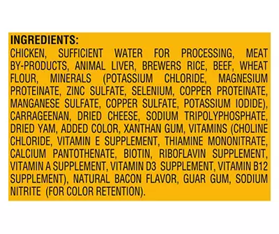 The image displays a list of ingredients, including chicken by-products and various vitamins, likely for pet food.